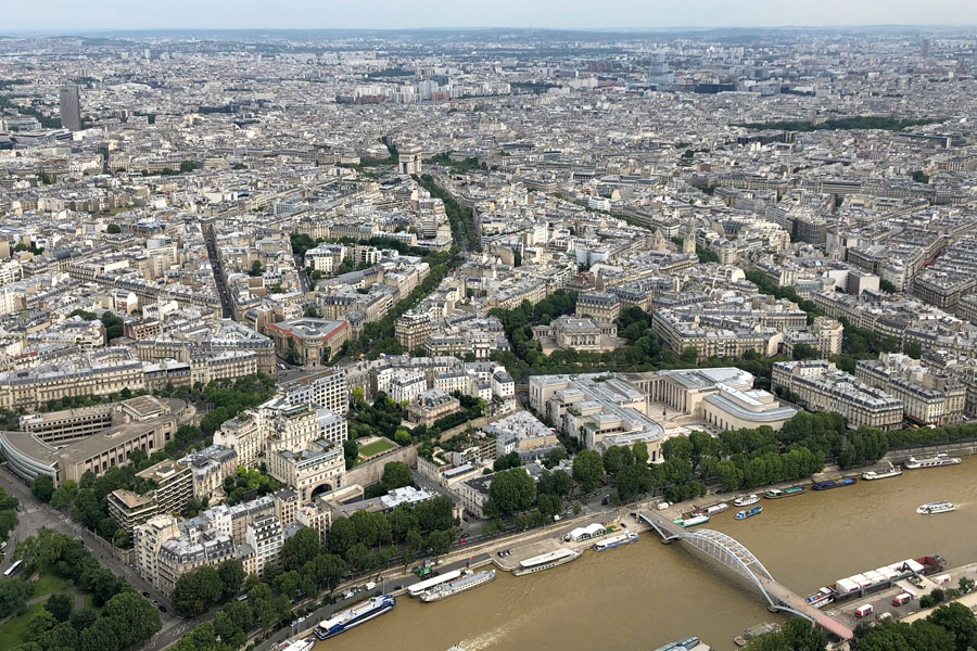 Paris Travel Guide: Top tips for how to visit the top of the Eiffel Tower in Paris France Paris overview with Arc de Triomphe
