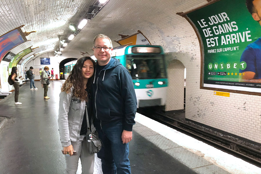 Paris Metro & Bus Public Transportation Guide: Father and daughter in Metro train tunnel.