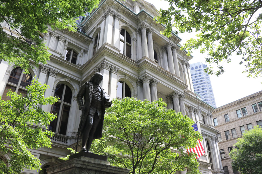 Family travel tips for visiting the Boston Freedom Trail in Boston, Massachusetts with historic sites - First school and Benjamin Franklin statue
