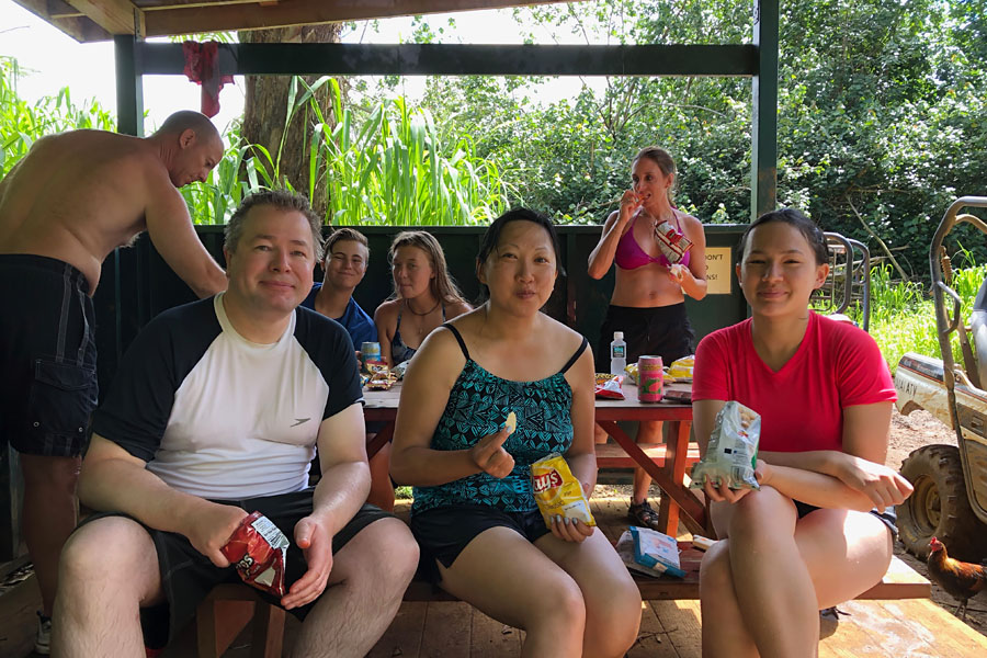 Kauai ATV Waterfall tour with family / teens in Ohana Bug in Kauai Hawaii Shelter with snacks by waterfall